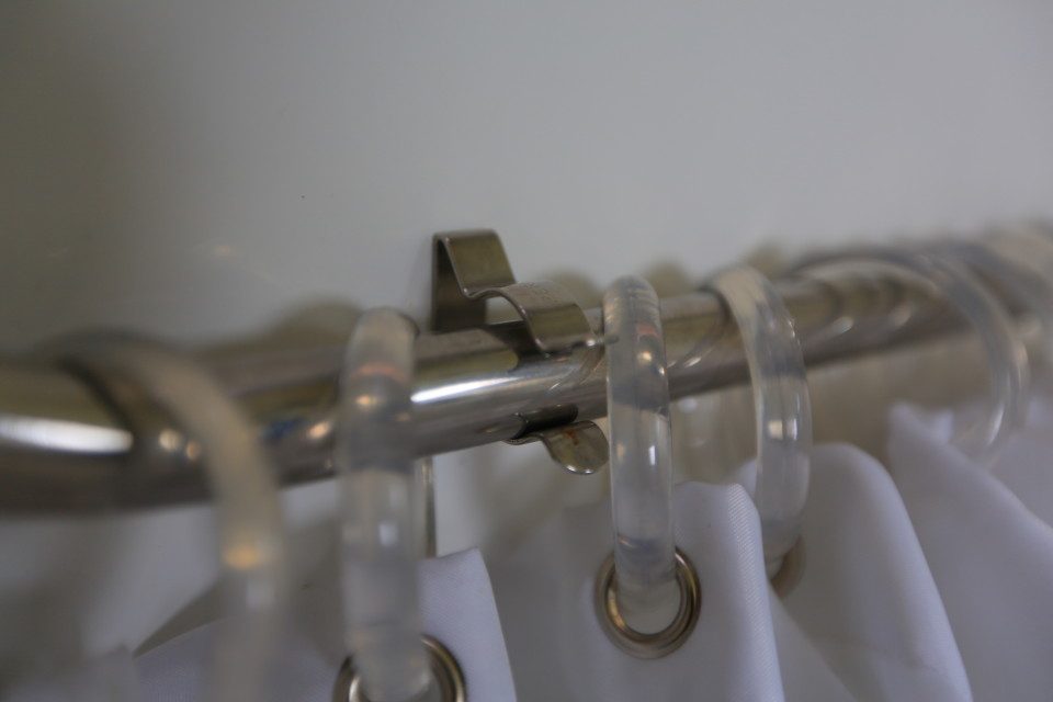 About once a week, we'll need to tighten these clips to keep the shower curtain secure when stored.