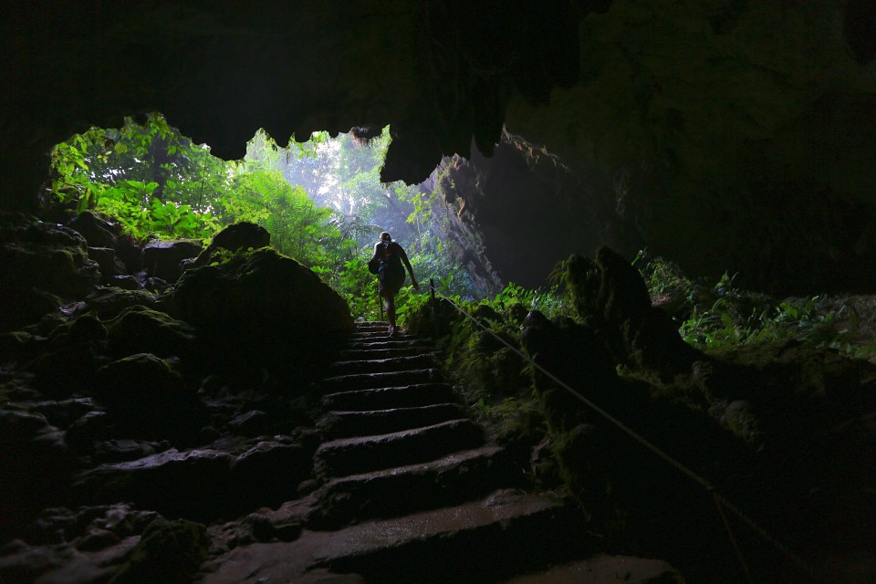 Climbing out of St. Herman's cave into the jungle.