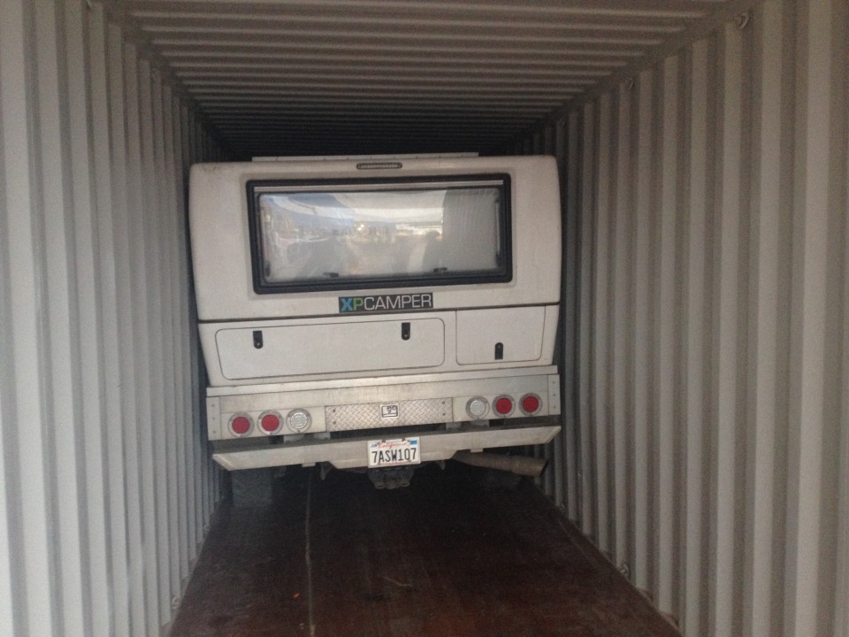 Yeah, our XPCamper is leaning against the side of the container.  That's not good.  Luckily there was no serious damage, just some minor scratches (we like to call that "character").