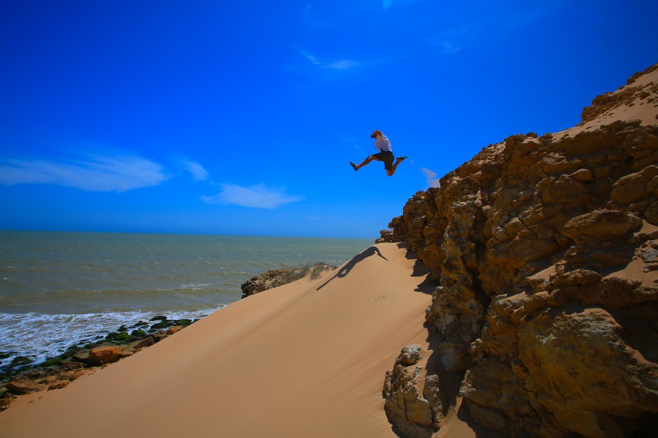 Toby taking a leap of faith down a huge dune near our camp site.