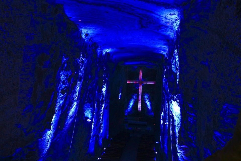 This is what it looked like in many places. dark, colorful lights, cross.