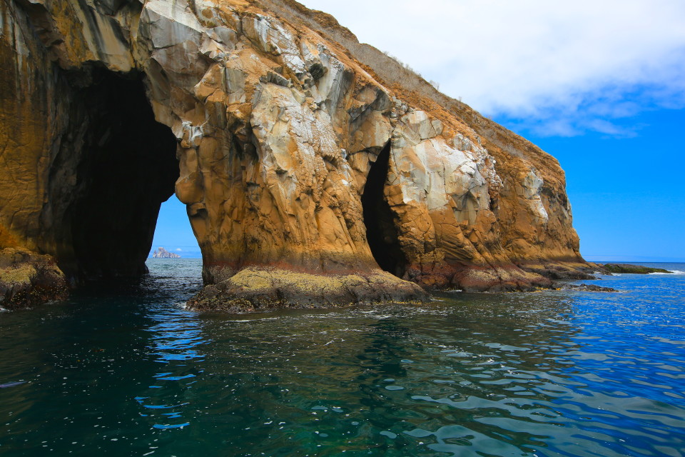 The captain of the boat called this the money shot. Kicker rock framed through a natural rock tunnel.