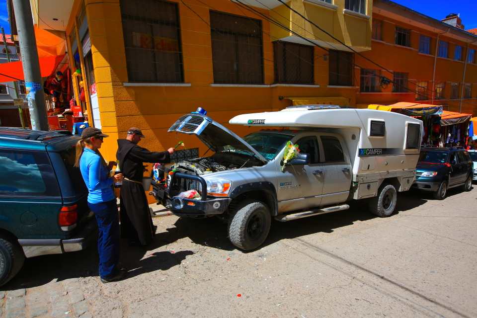 After the dressing was done, a priest came out and blessed the truck.  You can see him sprinkling holy water on our engine.