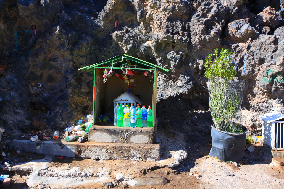 Shrines to the Difunta Correa (the unofficial saint of all travelers) litter the sides of the Ruta 40.  The story goes that the widow of a soldier killed in the civil war in the 1840s was traveling with her baby to recover his corpse.  Exhausted and dehydrated, she died on the road, but the baby was found alive, still suckling at her breast.  Now travelers leave an offering of a water bottle at these shrines to remember her.  Side note: we ran into a cyclist who mentioned that these water bottle shrines have saved him when he can't find water anywhere else.
